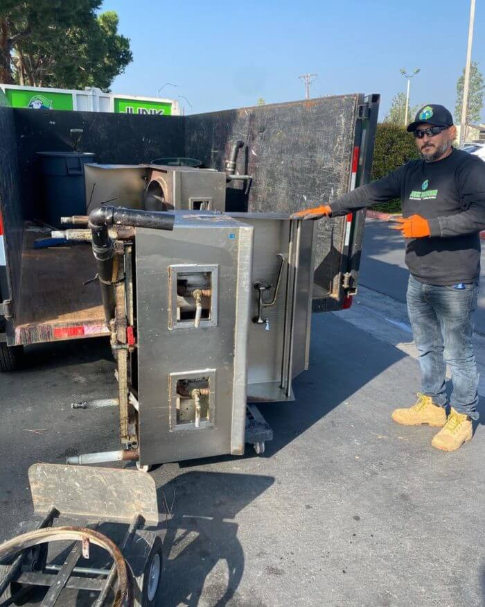 Junk solution employee with old appliances